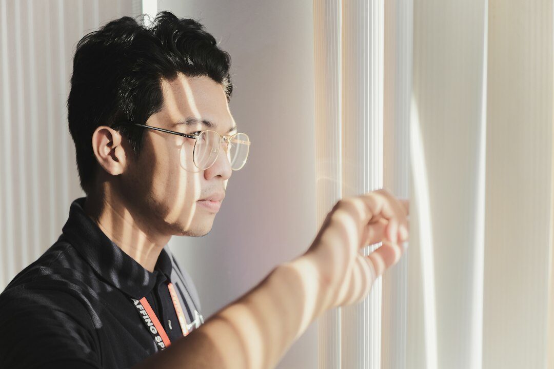 Portrait of a male cybersecurity instructor with glasses