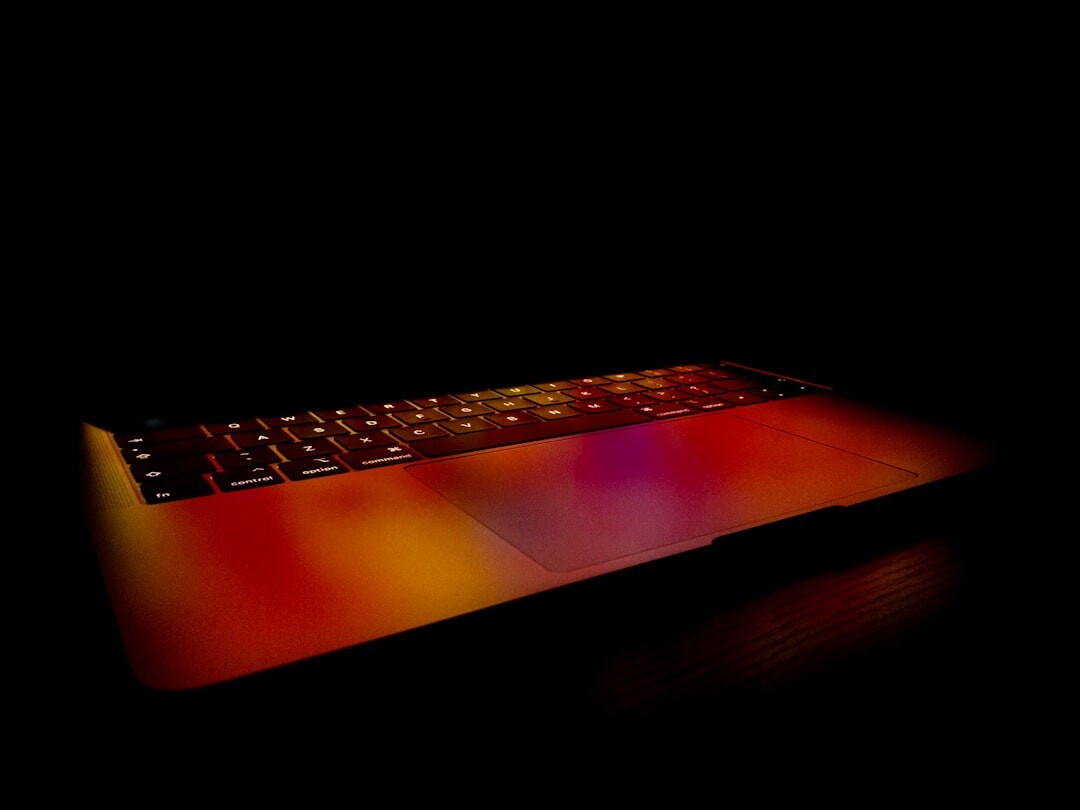 Close-up of a laptop screen showing colorful programming code