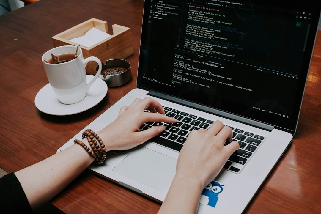 person learning to code on laptop