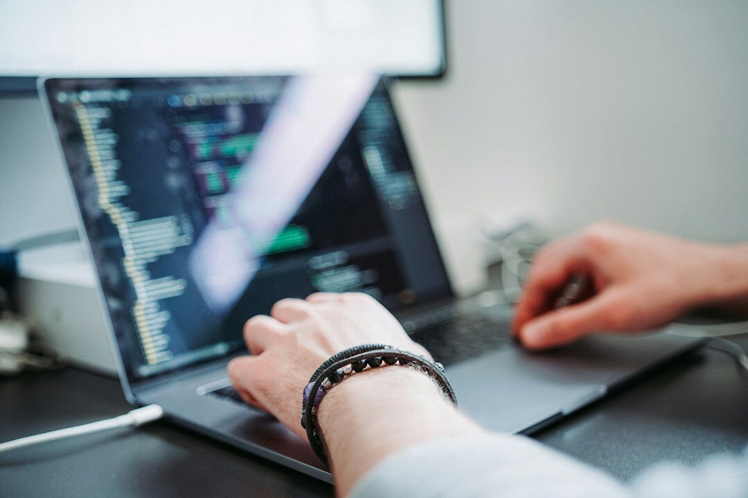 person learning to code on laptop